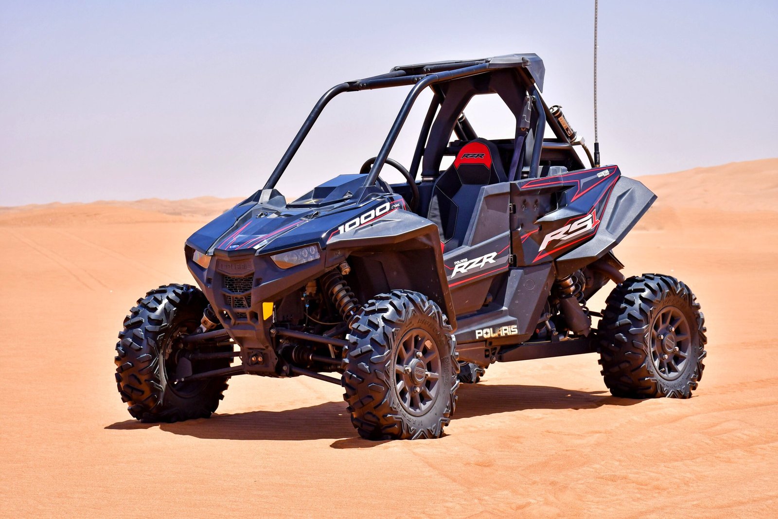 Quad bike riding adventure on desert dunes Dubai UAE