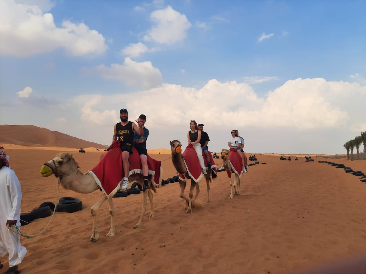 Camel caravan group ride in the Dubai desert