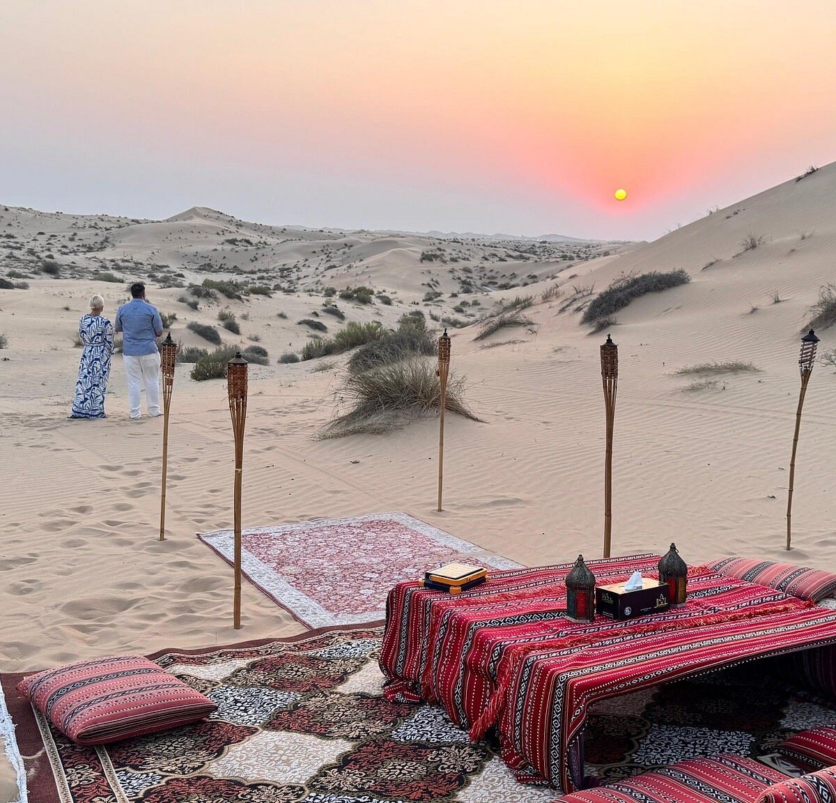 Sunset view over the dunes during a private desert dinner in Dubai